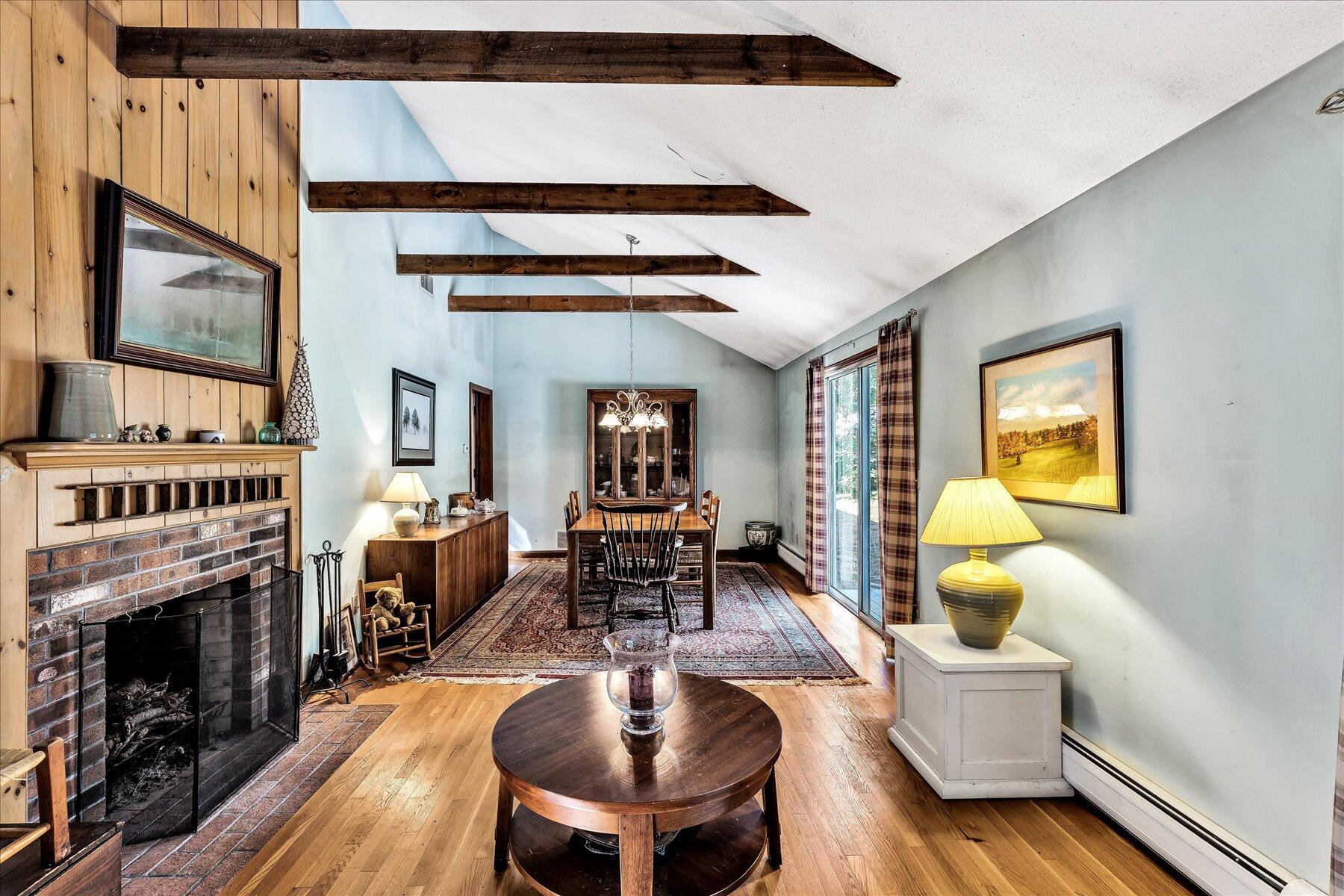 11 Barnacle Lane Mashpee, MA 02649 - Photo 5 of 38 a living room with furniture a fireplace and a flat screen tv