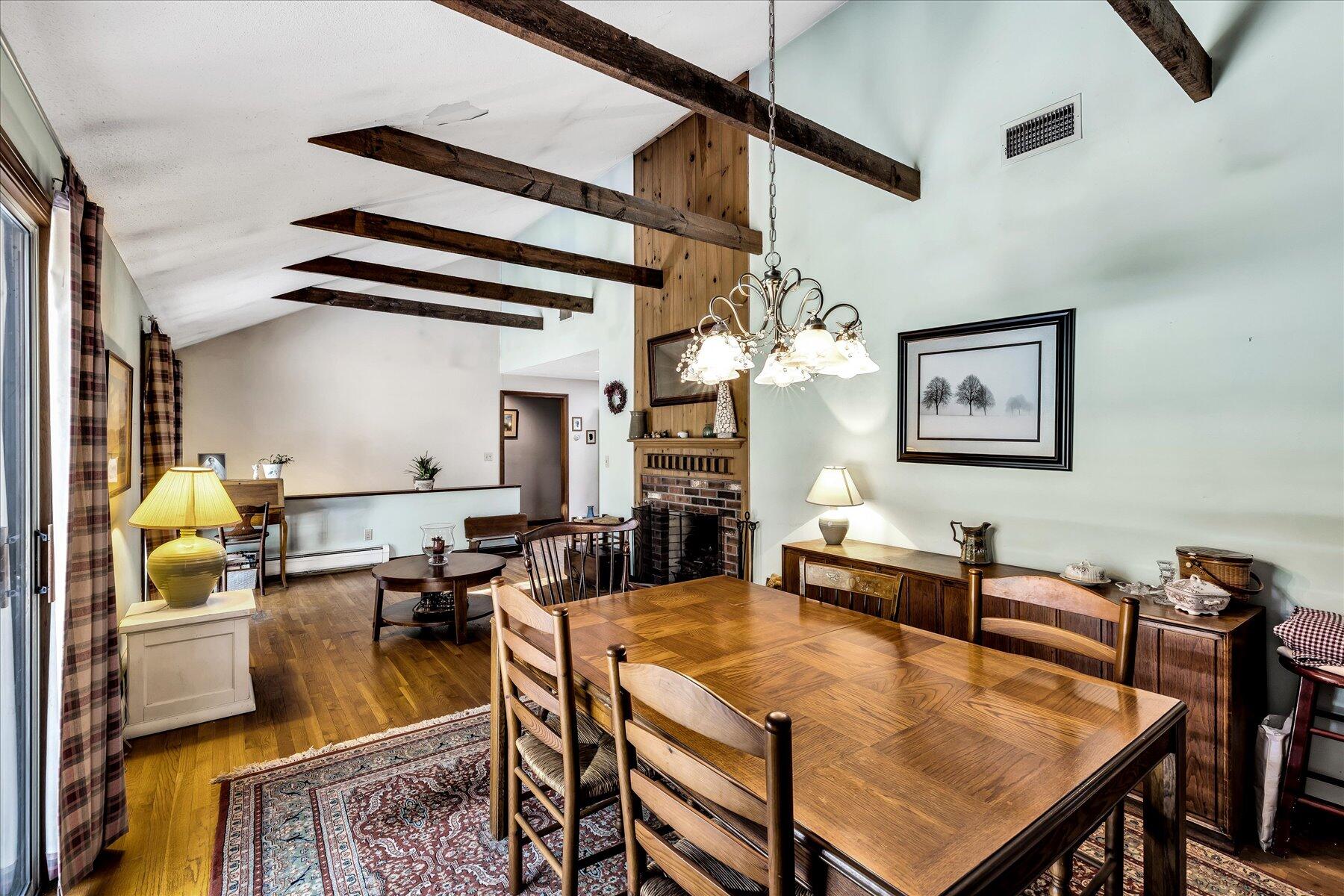 11 Barnacle Lane Mashpee, MA 02649 - Photo 8 of 38 a living room with dining table