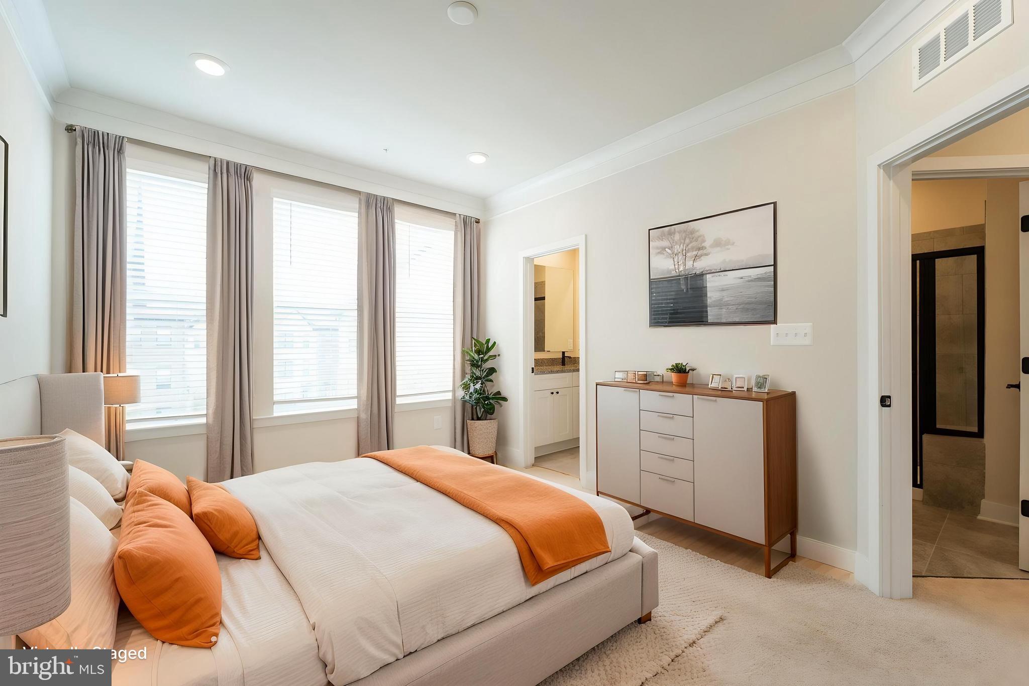 4334 Roland Heights Avenue Baltimore, MD 21211 - Photo 16 of 32 a bedroom with a bed and a flat screen tv