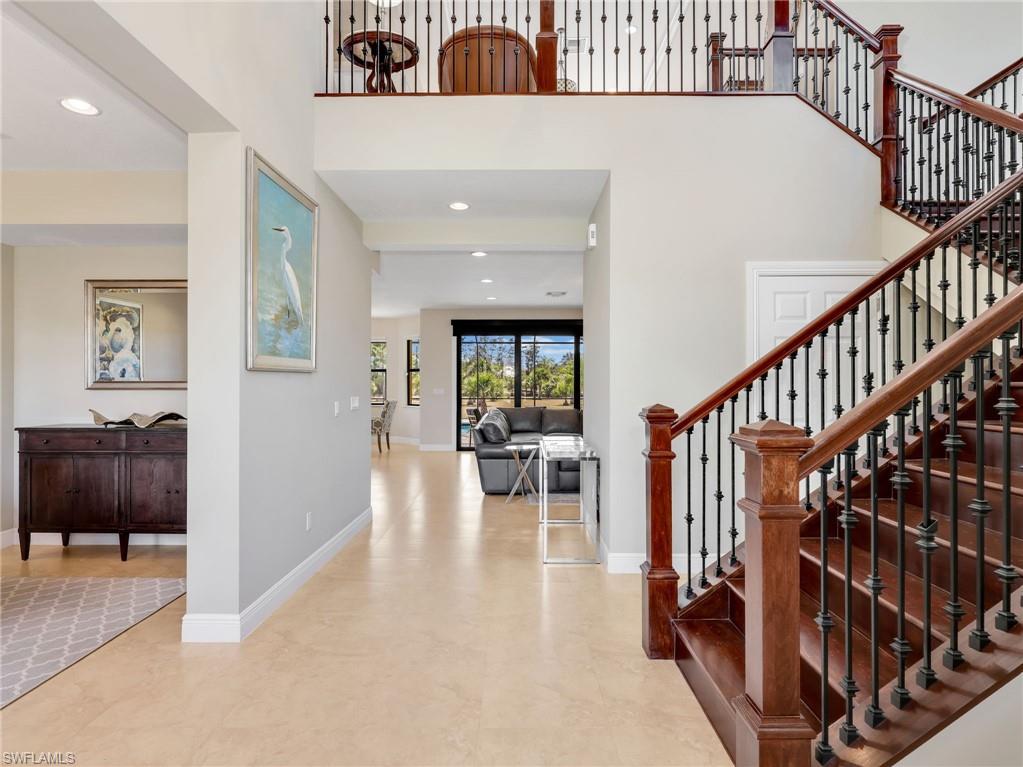 3160 27th Avenue Southwest Naples, FL 34117 - Photo 10 of 43 a view of front door with dining room and stairs