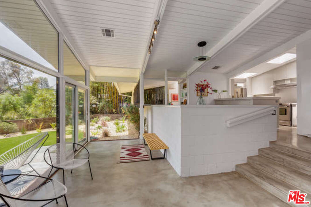 810 Bramble Way Los Angeles, CA 90049 - Photo 22 of 32 a view of a kitchen with furniture and windows