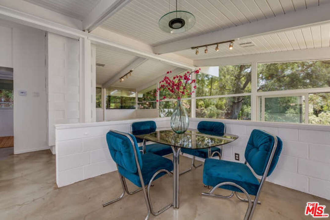 810 Bramble Way Los Angeles, CA 90049 - Photo 23 of 32 a view of a dining room with furniture window and outside view