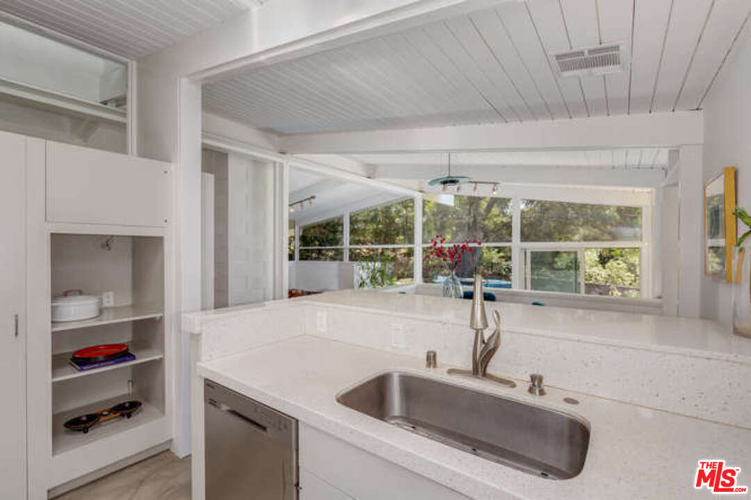 810 Bramble Way Los Angeles, CA 90049 - Photo 26 of 32 a kitchen with a sink and large window