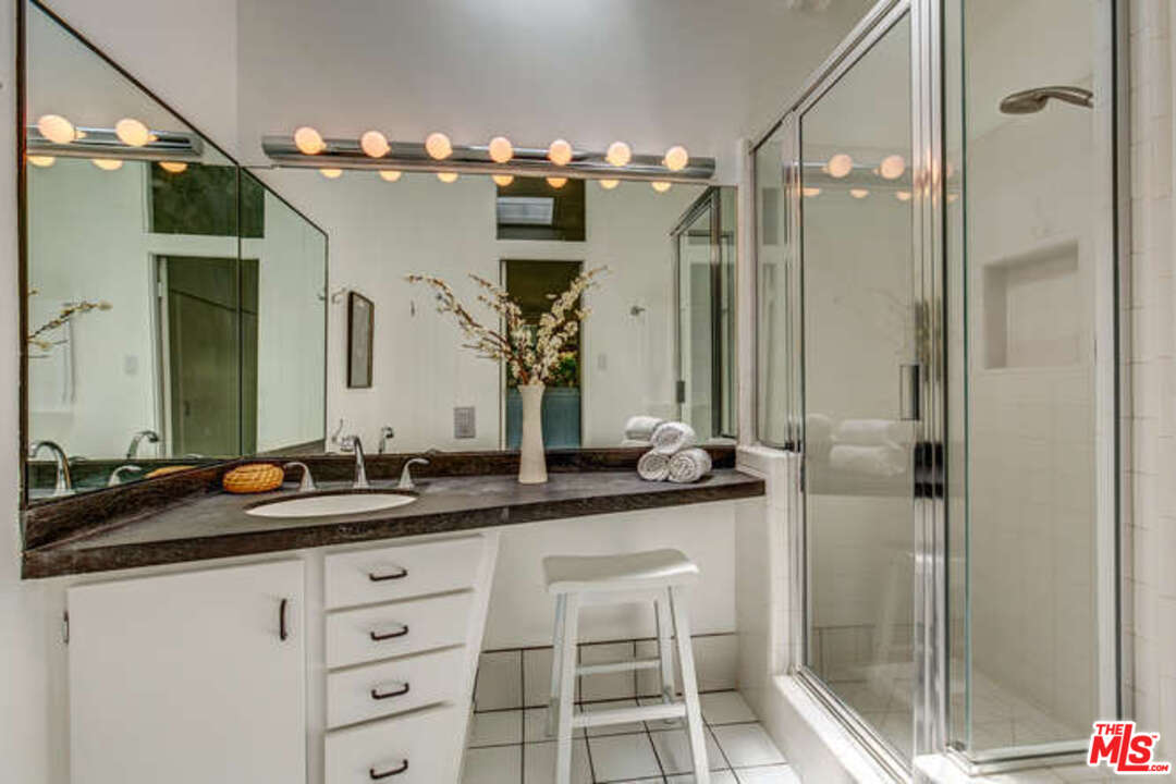 810 Bramble Way Los Angeles, CA 90049 - Photo 9 of 32 a bathroom with a double vanity sink and mirror