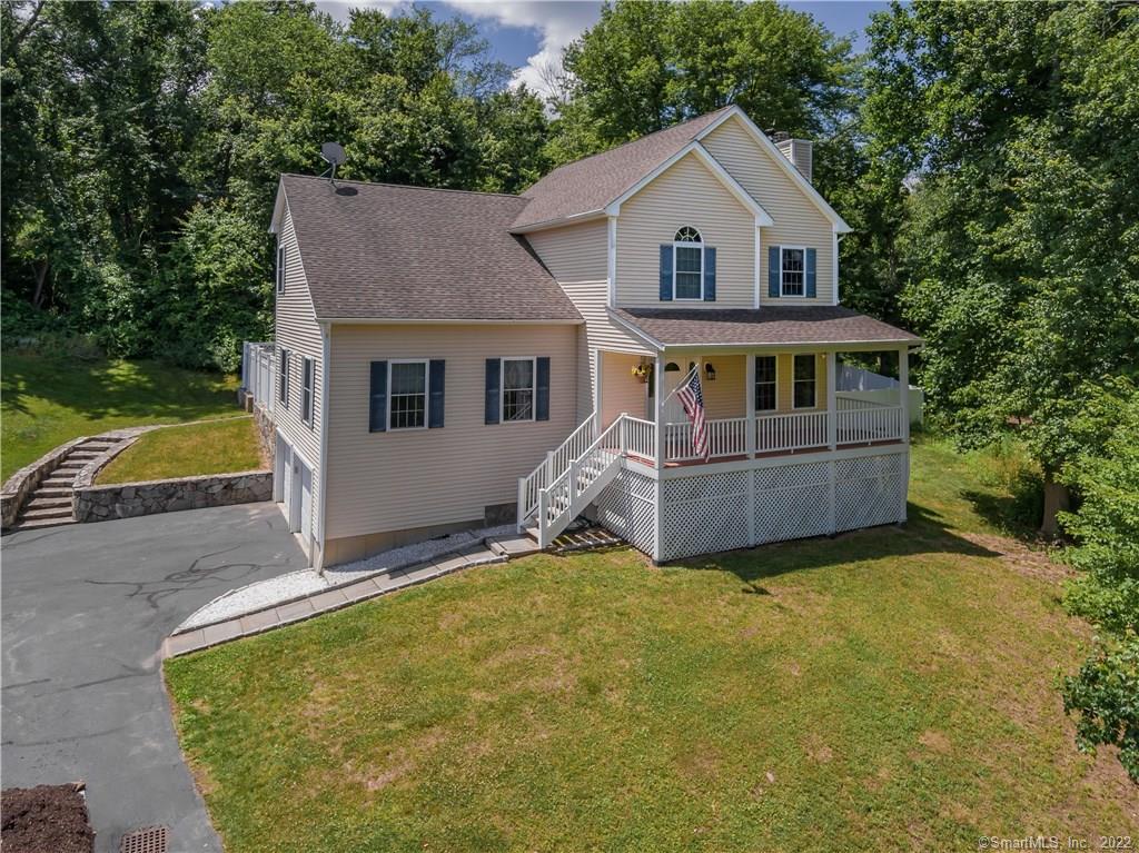 18 Hanover Ridge Road Brookfield, CT 06804 - Photo 1 of 1 a front view of house with yard and trees in the background