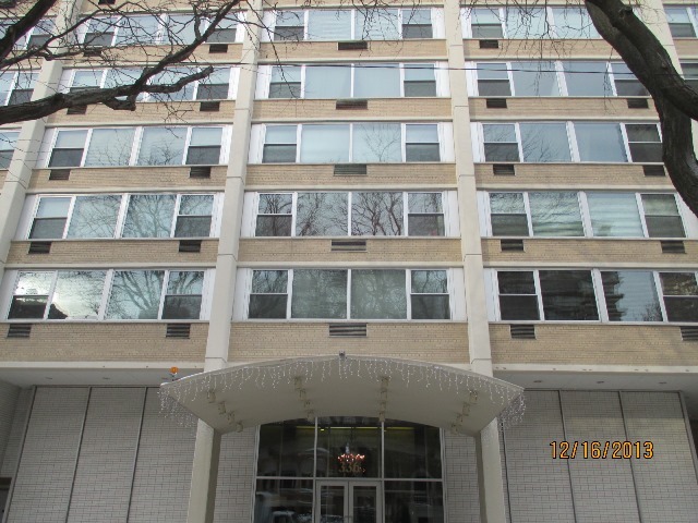 a front view of a building with a lot of windows