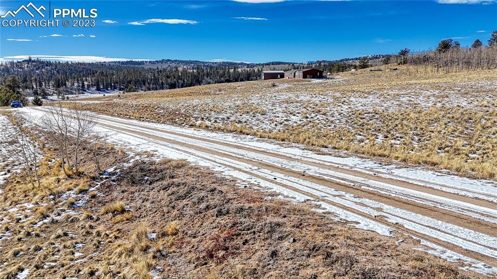651 Warrior Circle Como, CO 80432 - Photo 11 of 25 a view of a building with a yard