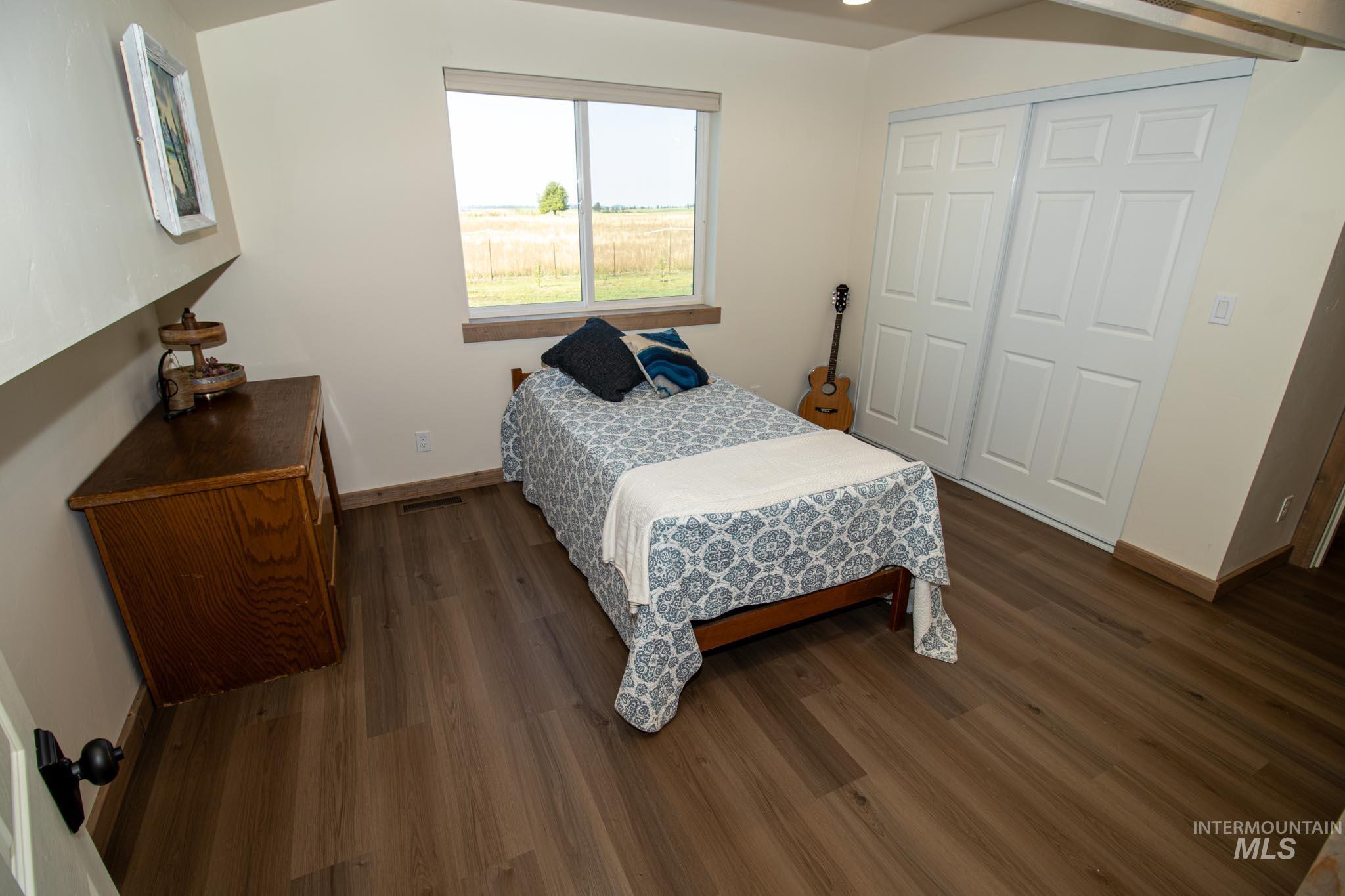 263 Glory Lane Orofino, ID 83544 - Photo 25 of 48 Bedroom featuring dark wood-type flooring and a closet