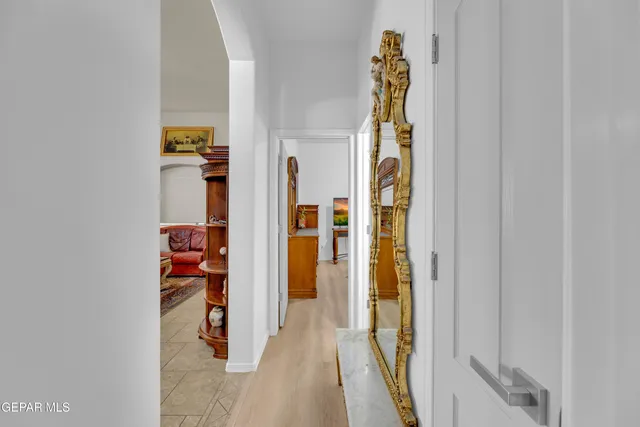 a view of walk in closet with clothes