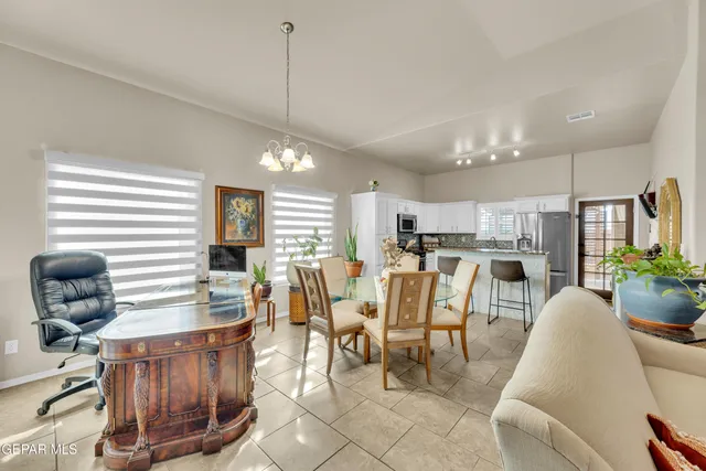 a dining room with furniture and wooden floor