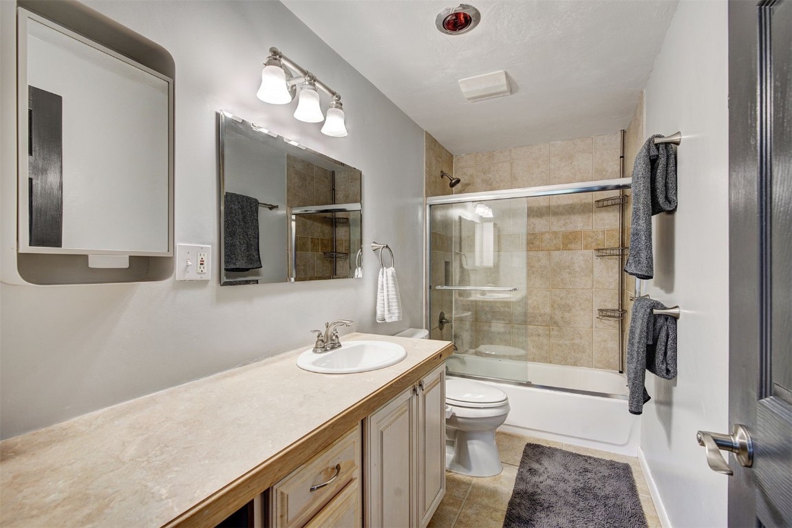 73 Illinois Gulch Road, Unit 8 Breckenridge, CO 80424 - Photo 16 of 24 a bathroom with a granite countertop sink toilet and shower