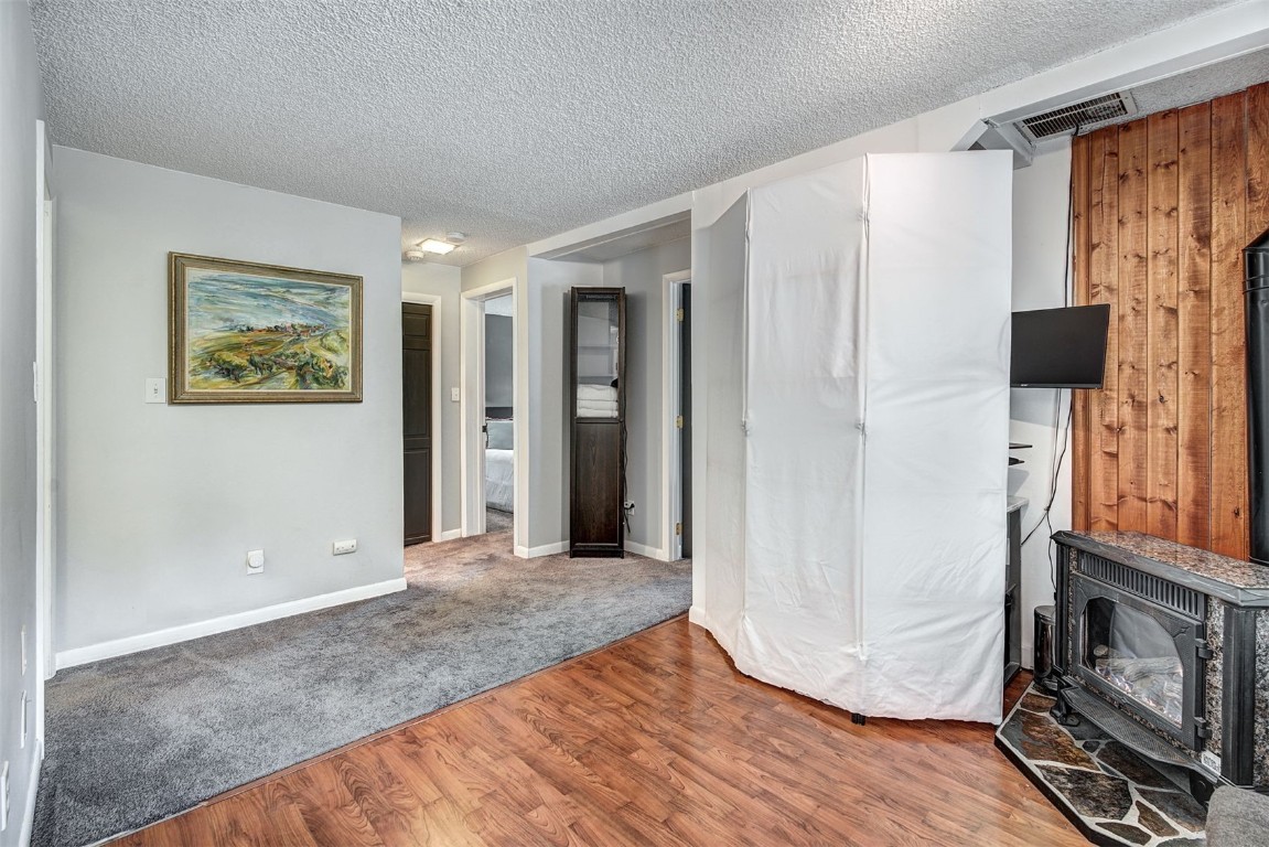 73 Illinois Gulch Road, Unit 8 Breckenridge, CO 80424 - Photo 18 of 24 a view of a livingroom with wooden floor and a refrigerator