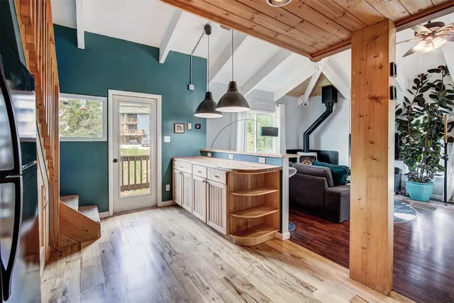 a view of living room kitchen and entryway
