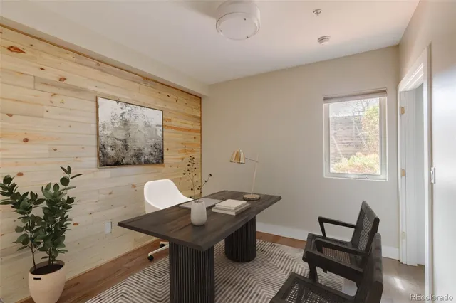 a view of a roof deck with couches and sky view