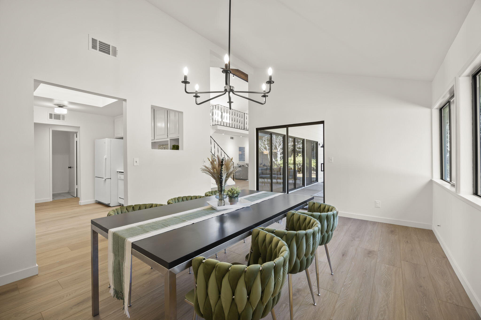 885 Oakwood Street Ojai, CA 93023 - Photo 15 of 35 a dining room with furniture and a chandelier