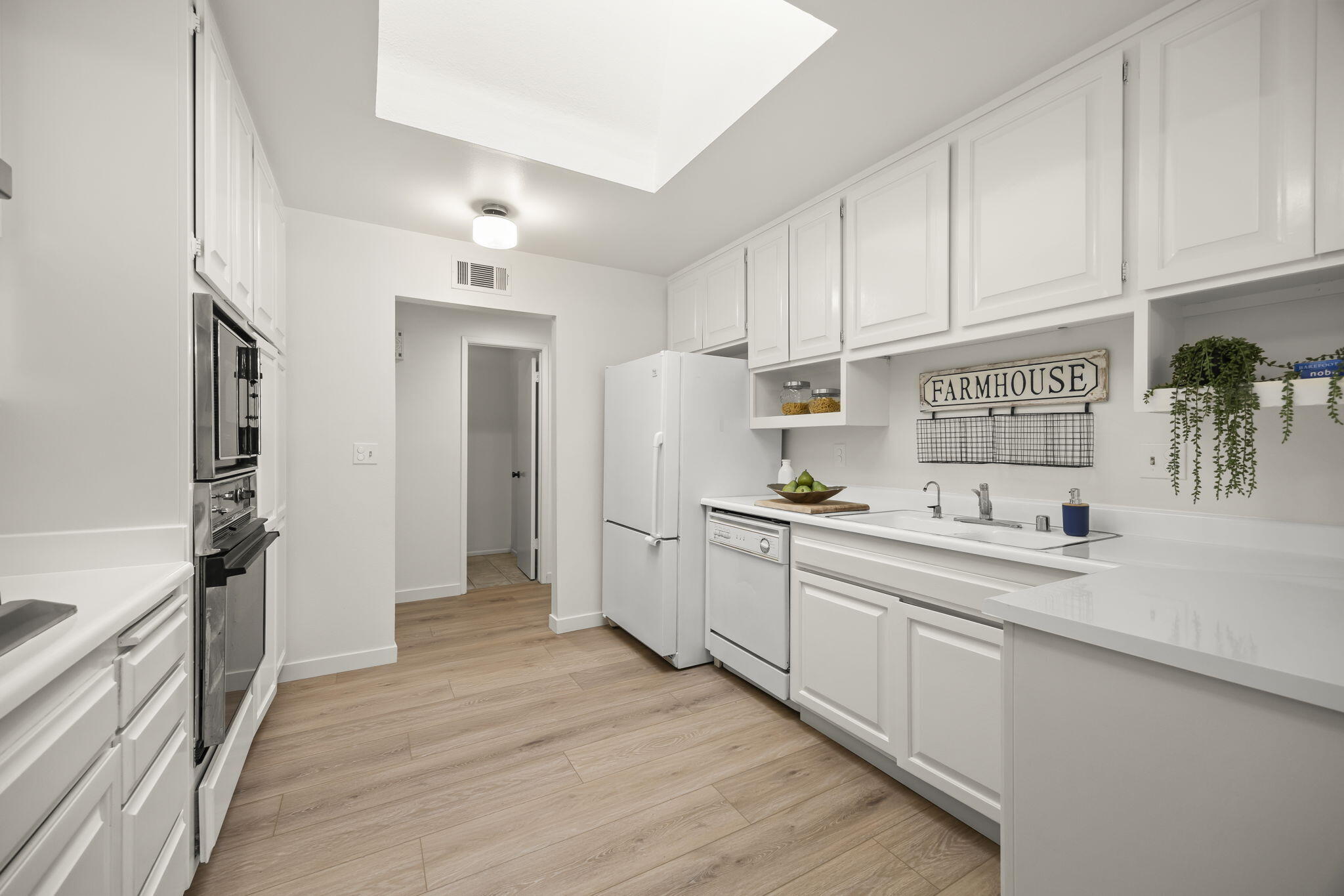 885 Oakwood Street Ojai, CA 93023 - Photo 2 of 35 a kitchen with granite countertop a sink and cabinets