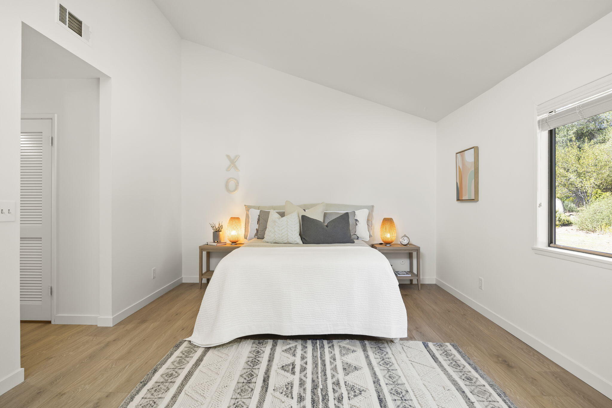 885 Oakwood Street Ojai, CA 93023 - Photo 21 of 35 a bed sitting in a bedroom next to a window