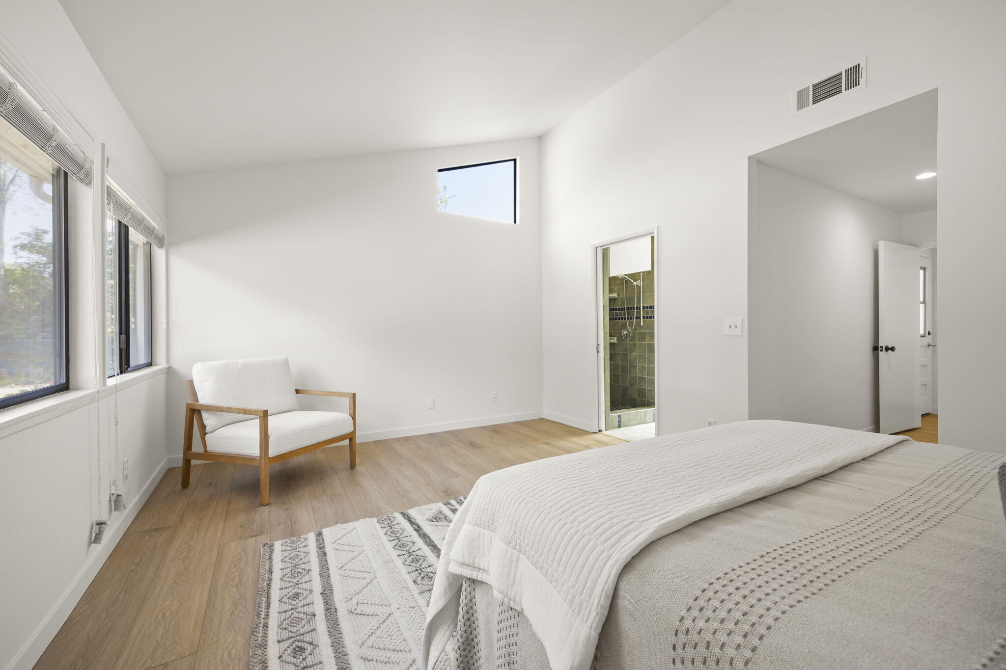 885 Oakwood Street Ojai, CA 93023 - Photo 22 of 35 a bedroom with a bed and a large mirror