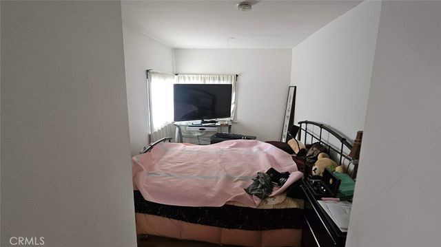 a living room with furniture and a book shelf
