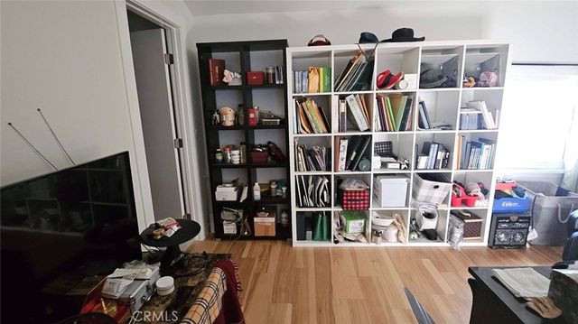 a living room with furniture fireplace and wooden floor