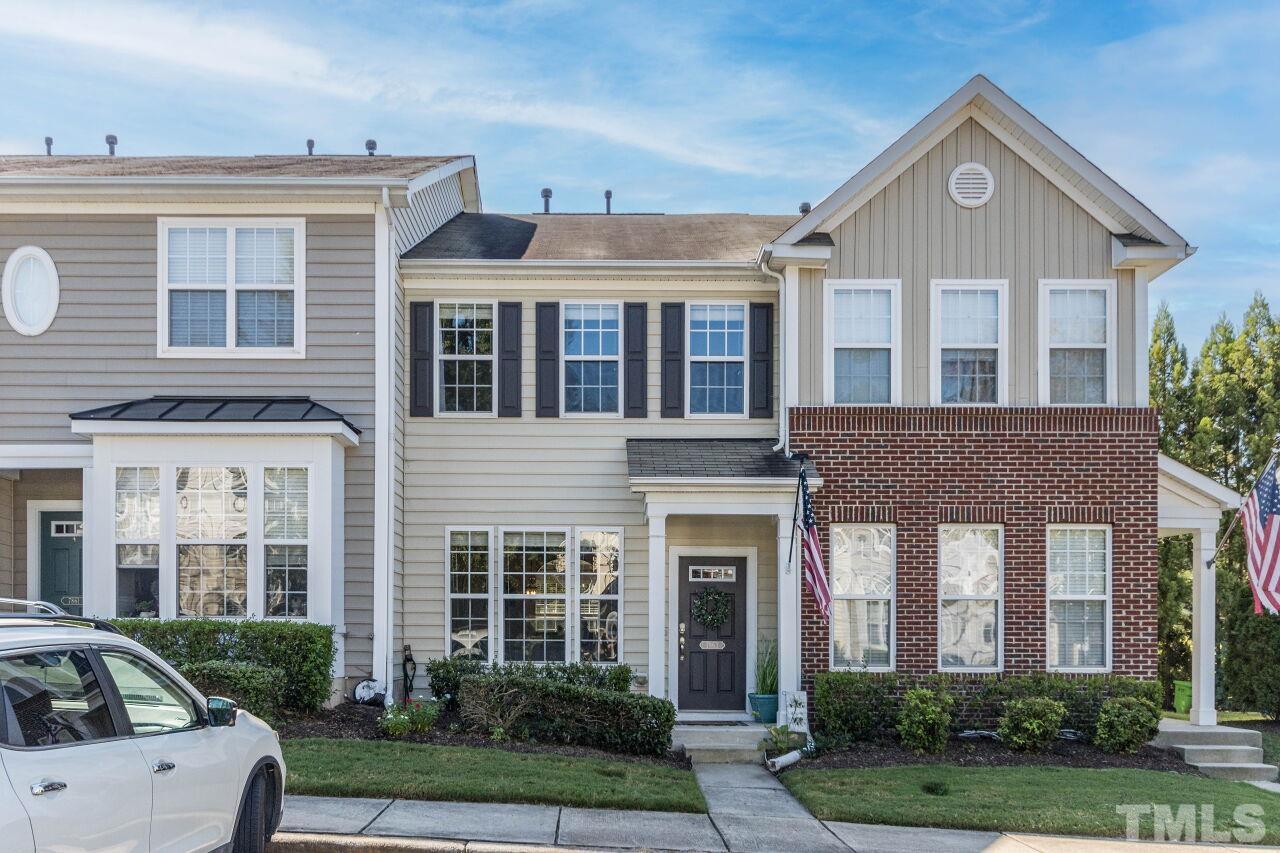 7863 Spungold Street Raleigh, NC 27617 - Photo 1 of 34 a front view of a house with garden