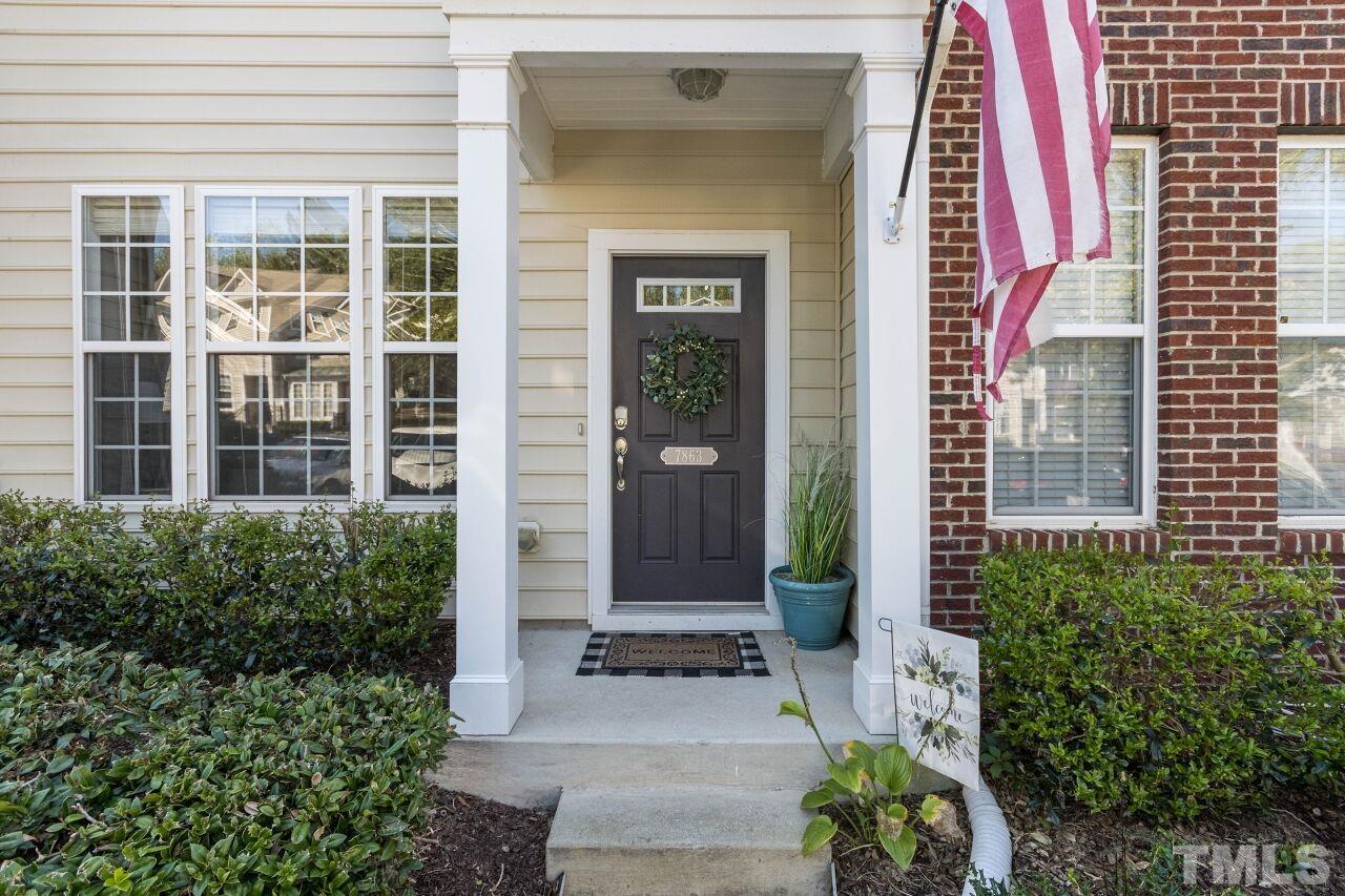 7863 Spungold Street Raleigh, NC 27617 - Photo 3 of 34 a front view of a house with a yard