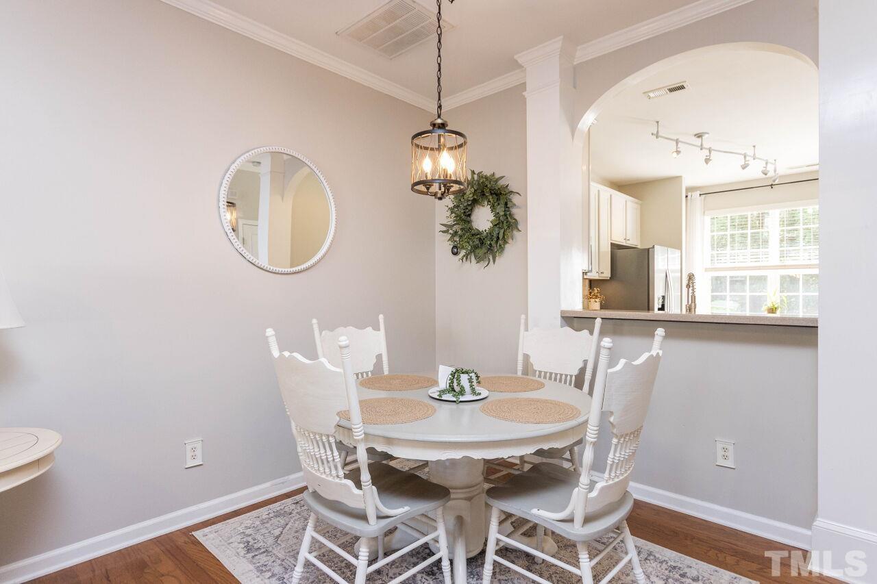 7863 Spungold Street Raleigh, NC 27617 - Photo 7 of 34 a dining room with furniture and window