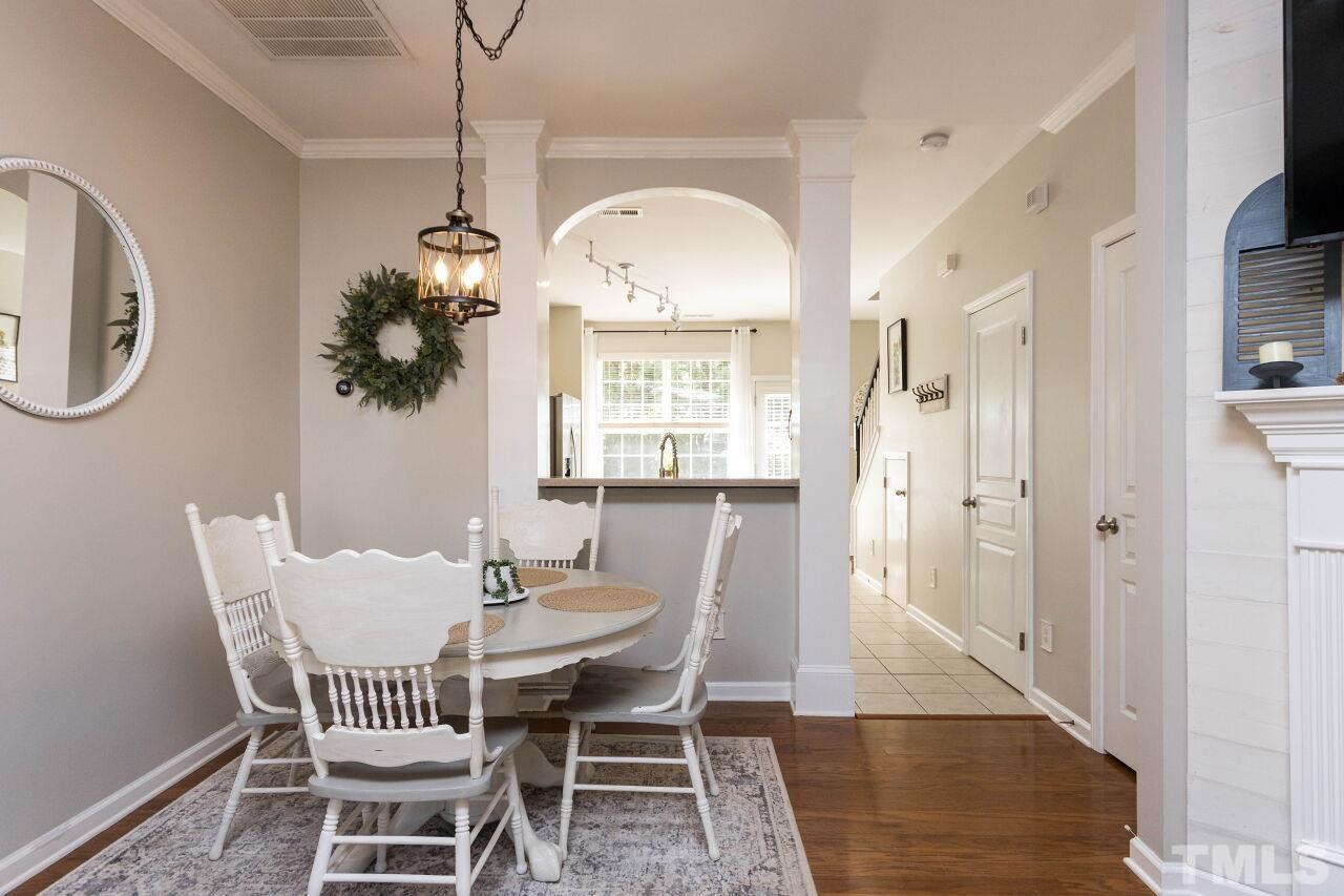 7863 Spungold Street Raleigh, NC 27617 - Photo 8 of 34 a view of a dining room with furniture and chandelier