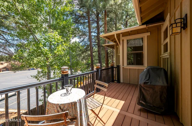 a view of a balcony with furniture