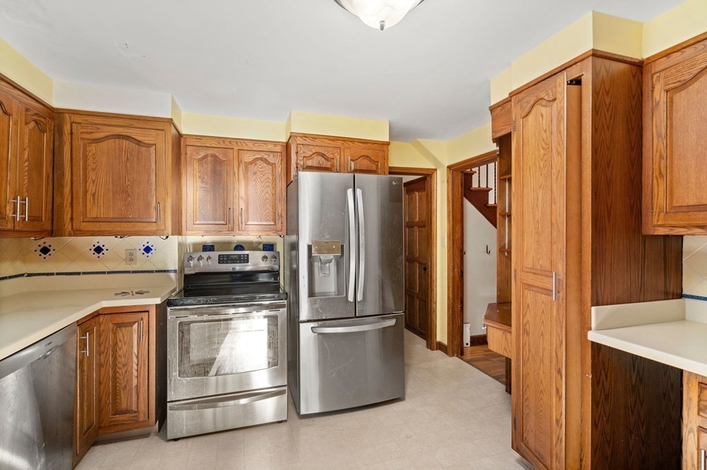 3 Old English Road Worcester, MA 01609 - Photo 11 of 36 a kitchen with stainless steel appliances a stove and a refrigerator