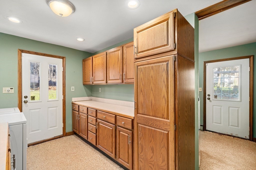 3 Old English Road Worcester, MA 01609 - Photo 13 of 36 a kitchen with stainless steel appliances granite countertop a refrigerator and a stove top oven