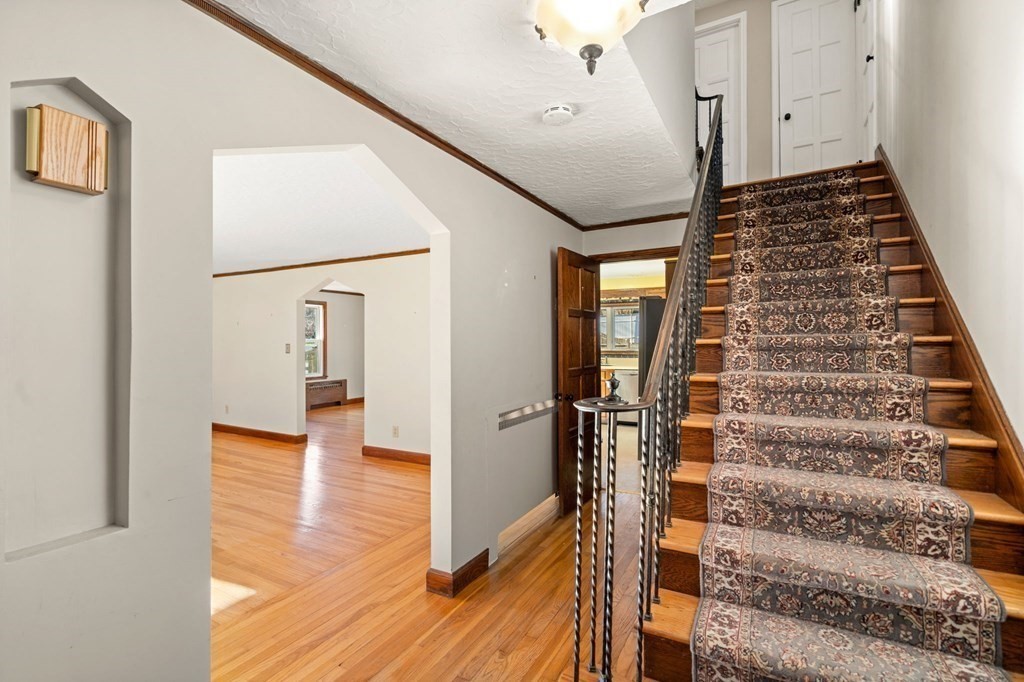 3 Old English Road Worcester, MA 01609 - Photo 17 of 36 a view of a hallway with wooden floor and staircase