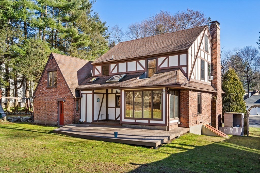 3 Old English Road Worcester, MA 01609 - Photo 2 of 36 a front view of a house with a yard table and chairs