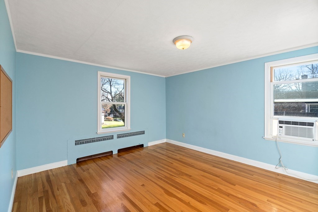 3 Old English Road Worcester, MA 01609 - Photo 21 of 36 a view of an empty room with wooden floor and a window