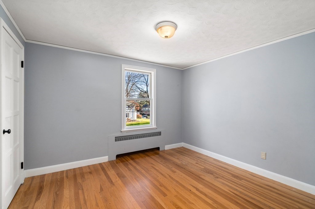 3 Old English Road Worcester, MA 01609 - Photo 26 of 36 a view of an empty room with wooden floor and a window