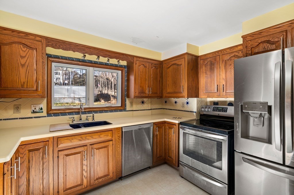 3 Old English Road Worcester, MA 01609 - Photo 10 of 36 a kitchen with a sink stove and refrigerator