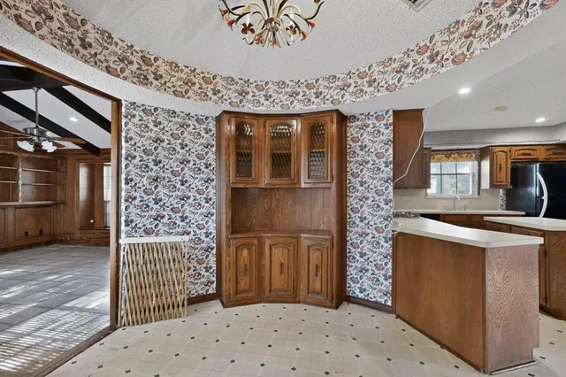 a bedroom with a bed and a chair