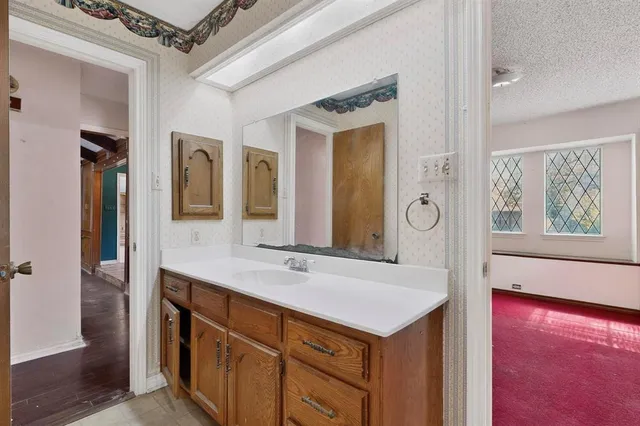 a bathroom with a sink and a mirror