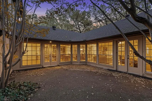 a view of an empty room with a balcony