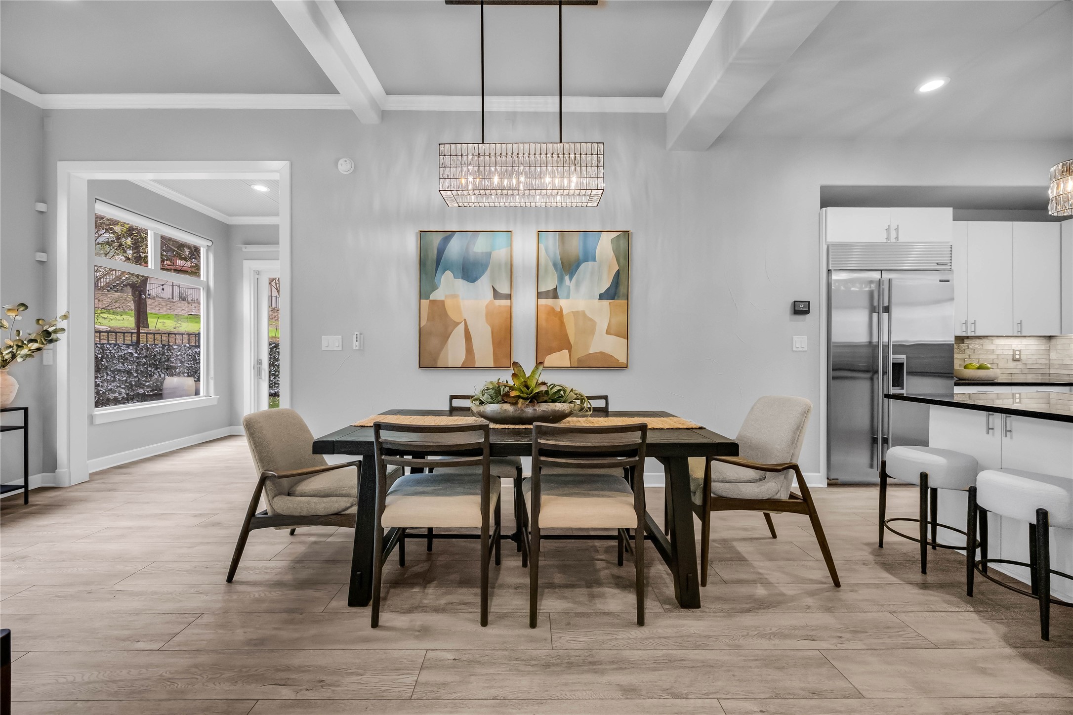 2800 Waymaker Way, Unit 36 Austin, TX 78746 - Photo 12 of 40 a view of a dining room with furniture window and wooden floor