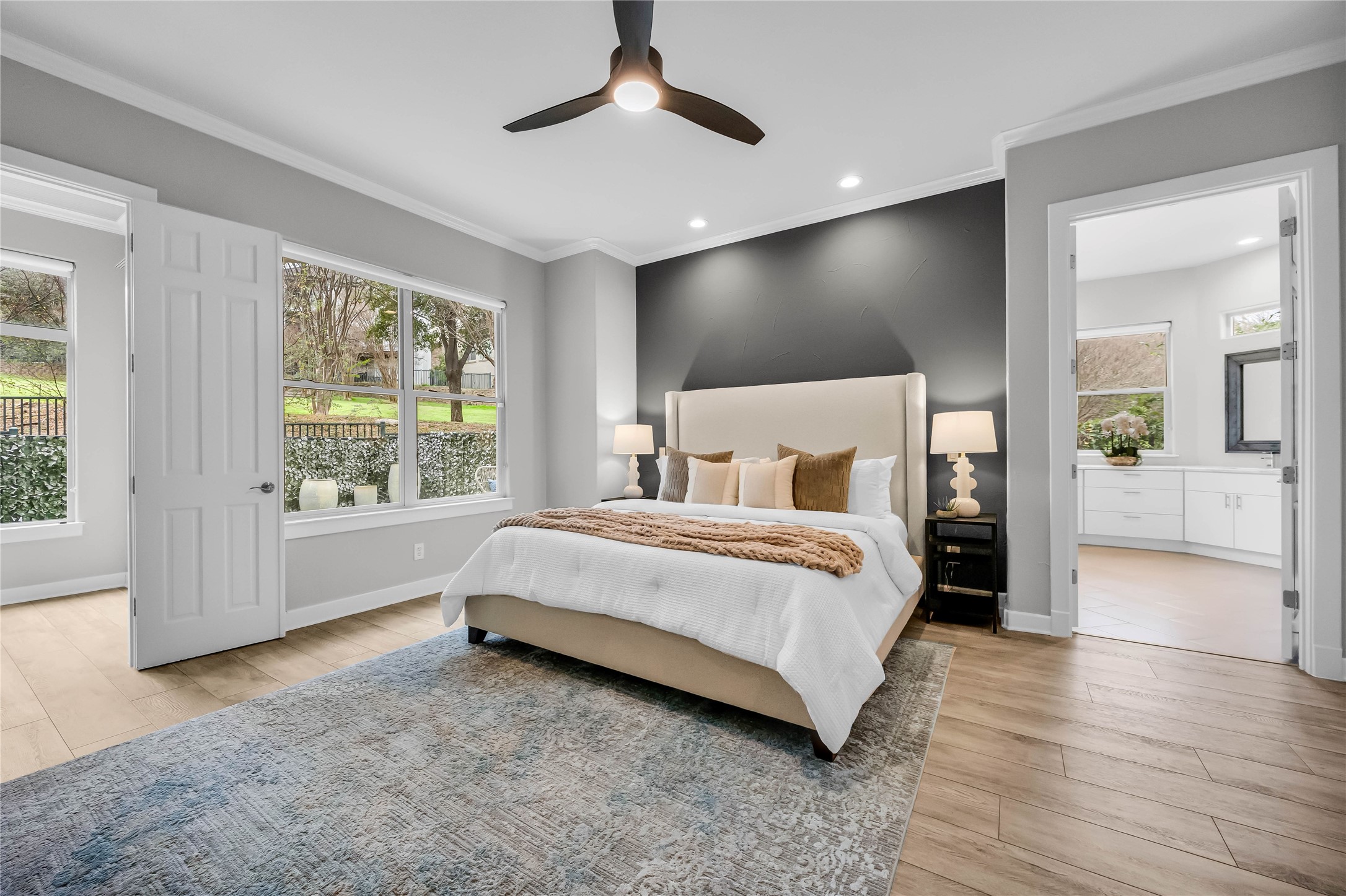 2800 Waymaker Way, Unit 36 Austin, TX 78746 - Photo 14 of 40 a bedroom with a large bed and a chandelier