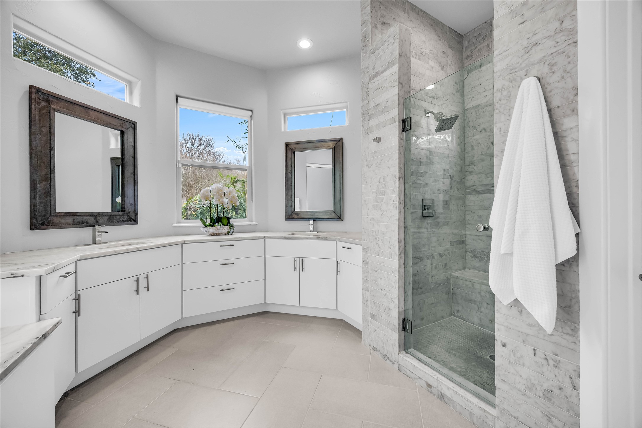 2800 Waymaker Way, Unit 36 Austin, TX 78746 - Photo 15 of 40 a spacious bathroom with a double vanity sink and a mirror