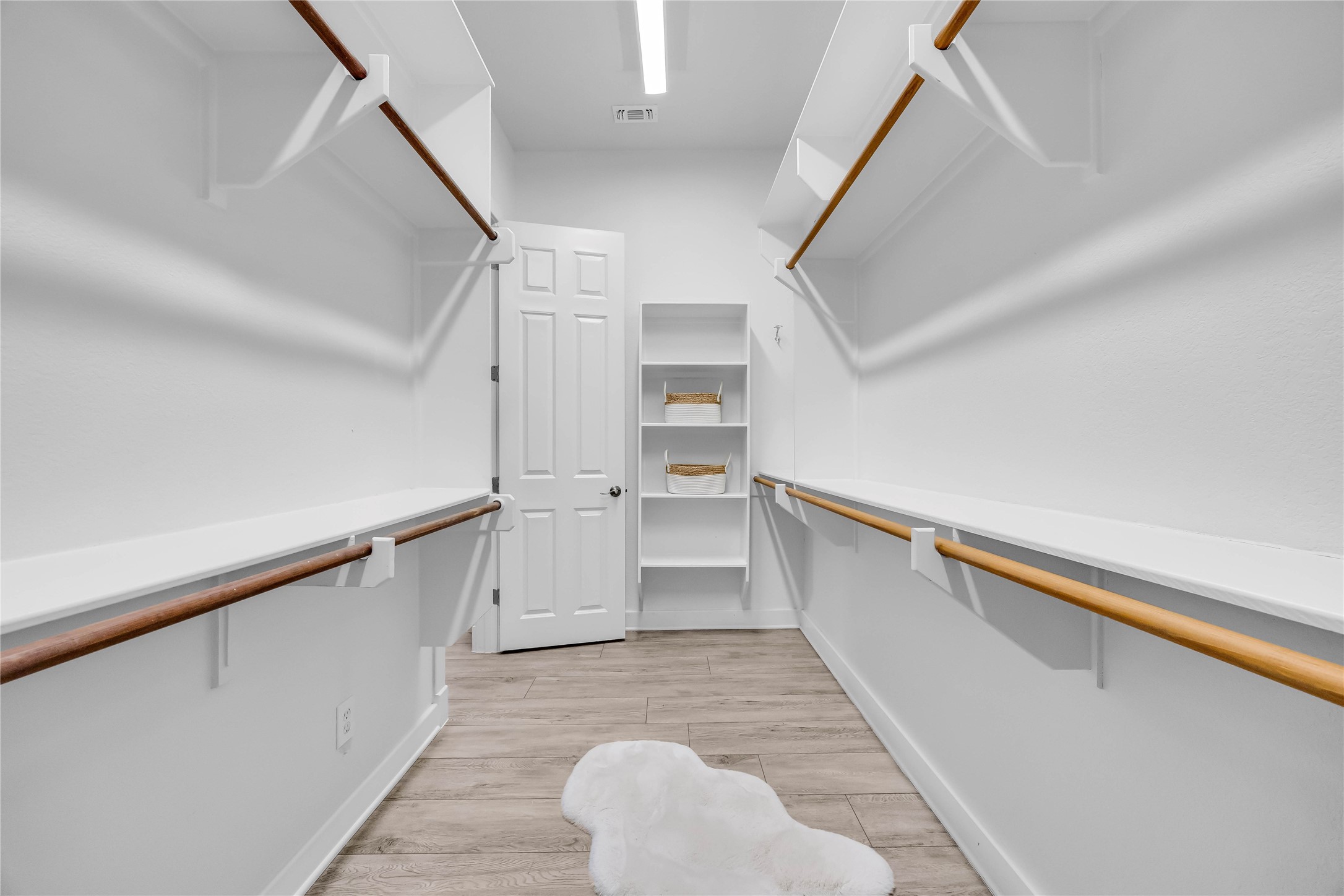 2800 Waymaker Way, Unit 36 Austin, TX 78746 - Photo 17 of 40 a view of a kitchen with wooden floor and electronic appliances