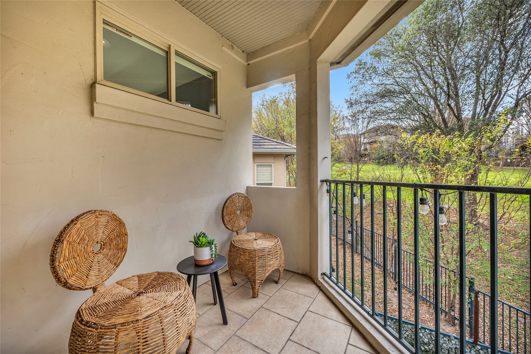 2800 Waymaker Way, Unit 36 Austin, TX 78746 - Photo 24 of 40 a view of a door and chair in the balcony