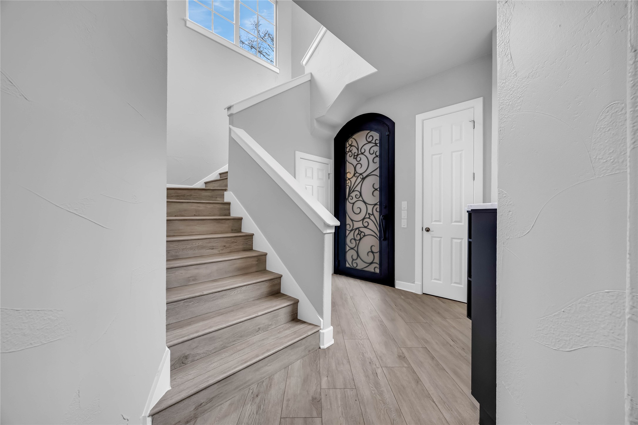 2800 Waymaker Way, Unit 36 Austin, TX 78746 - Photo 3 of 40 a view of entryway with wooden floor