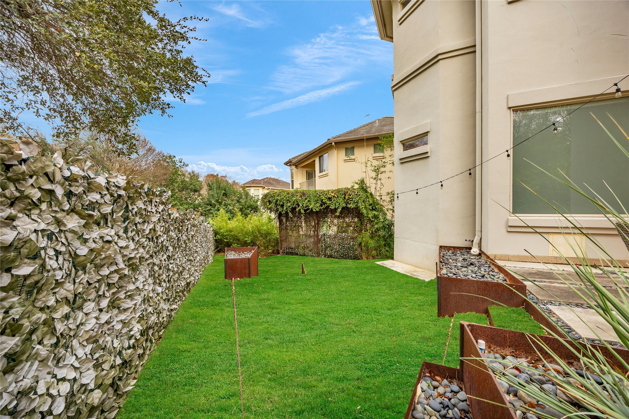 2800 Waymaker Way, Unit 36 Austin, TX 78746 - Photo 34 of 40 a view of a back yard of the house