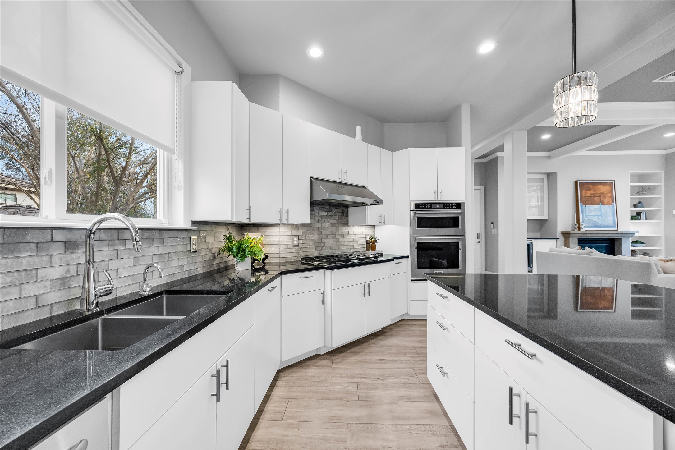 2800 Waymaker Way, Unit 36 Austin, TX 78746 - Photo 10 of 40 a large kitchen with stainless steel appliances granite countertop a sink a stove and cabinets