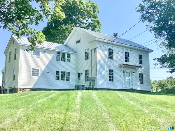front view of a house with a yard