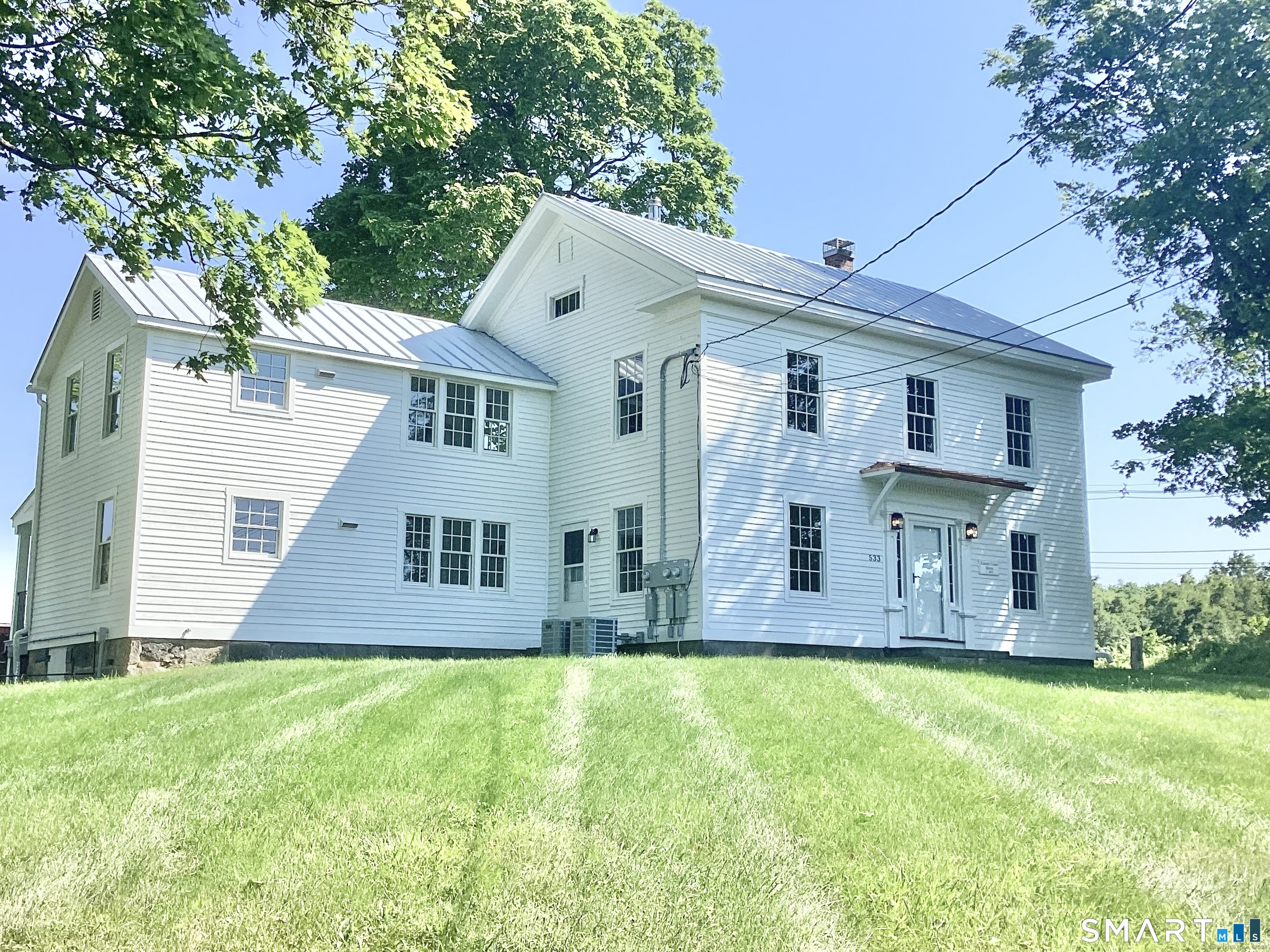 front view of a house with a yard