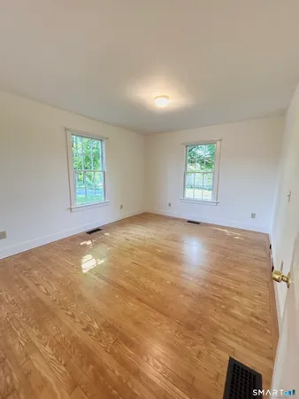 a view of a kitchen island wooden floor and staircase